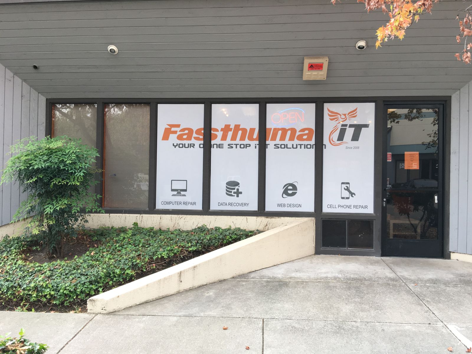 Fasthuma Computer Repair storefront at 42307 Osgood Rd, Suite B, Fremont, CA: windows with the Fasthuma iT logo and computer repair and data recovery signs next to the front door.